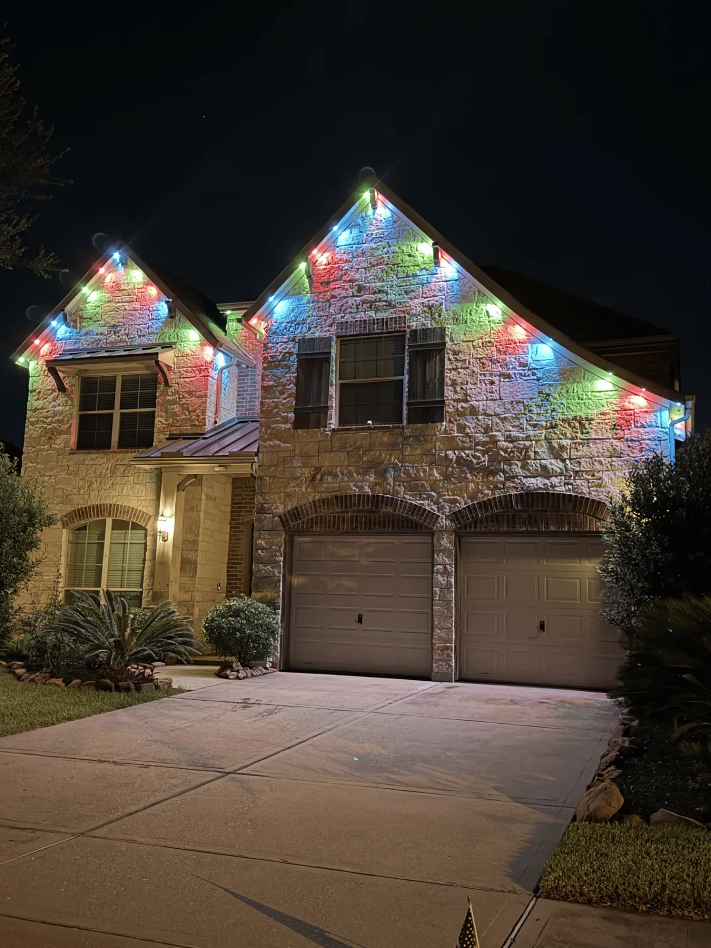 Red, green and blue permanent LED lighting on a two-story Katy TX home